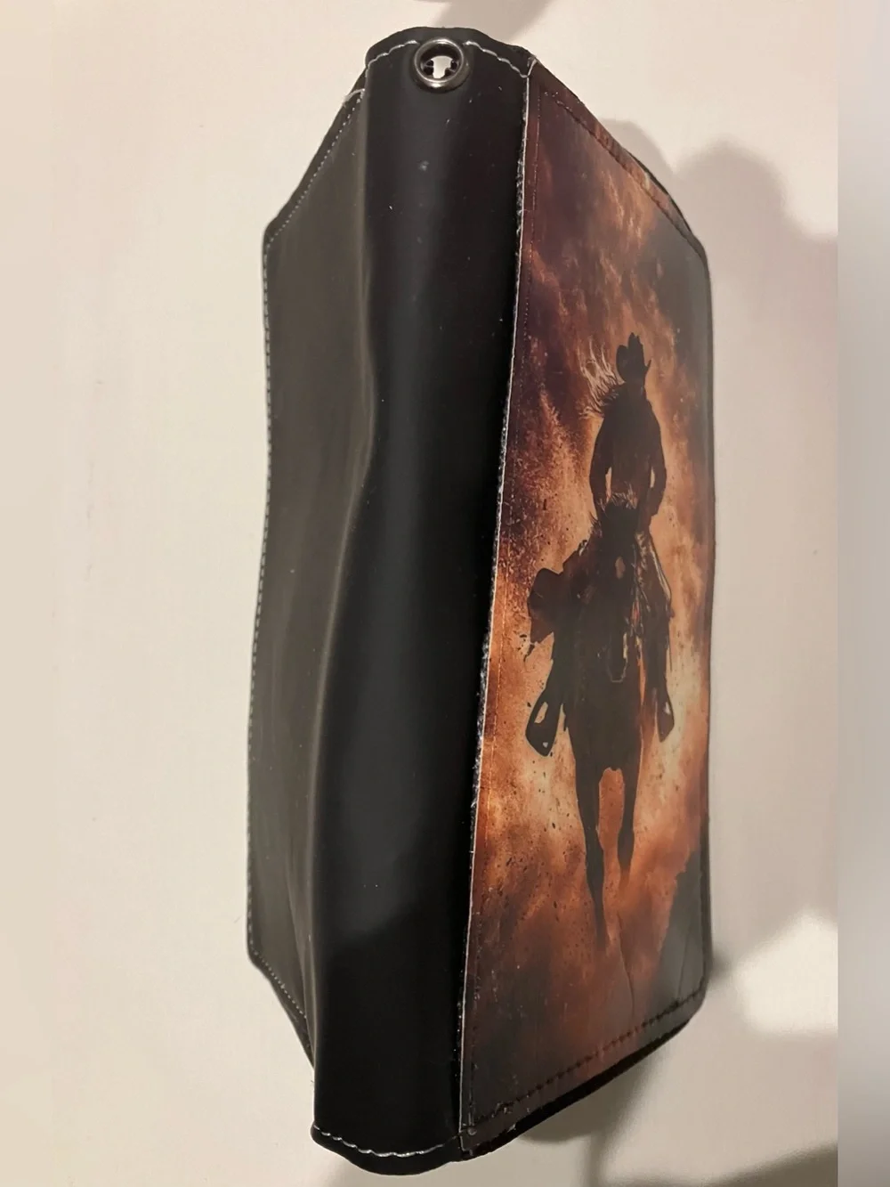 Western-themed zip-around wallet cowboy riding horse sunset